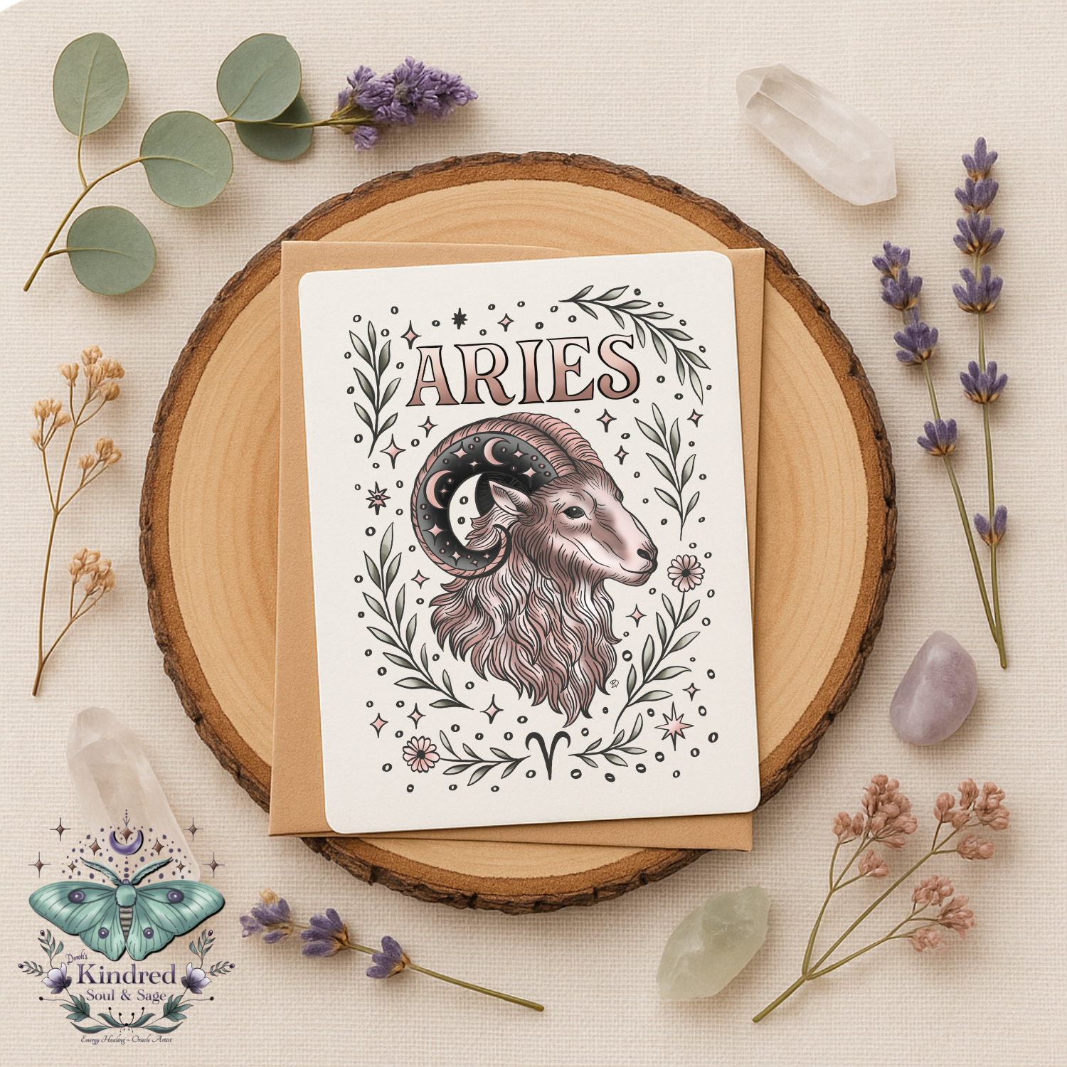 Card with Aries illustration on a wooden round board with flowers and crystals.
