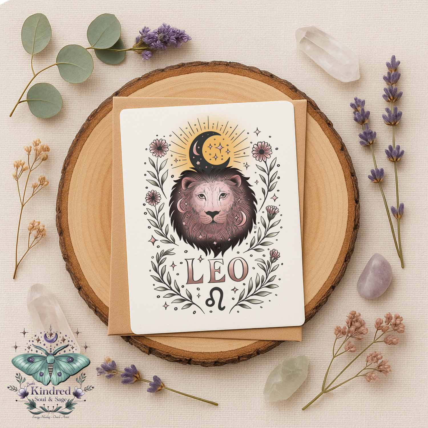Greeting card with Leo zodiac design on a wooden round surface with flowers and crystals.